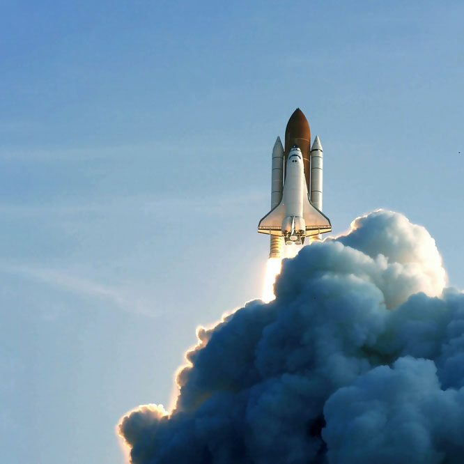 The launch of the space shuttle against the background of the sky and smoke. Elements of this image furnished by NASA. High quality photo